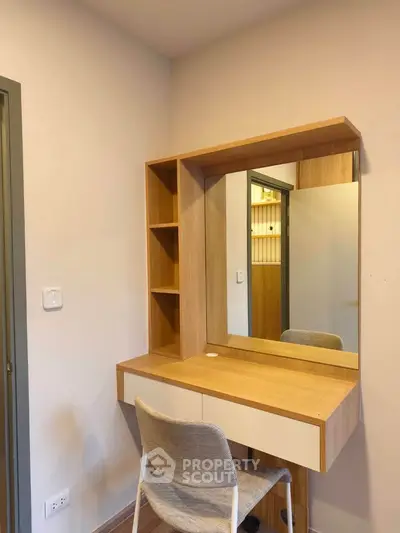 Modern study nook with wooden desk and mirror in cozy apartment