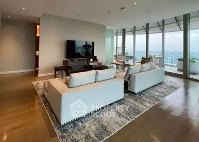 Luxurious living room with panoramic city view and modern furnishings.