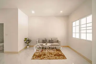 Modern minimalist living room with cozy sofa and stylish decor