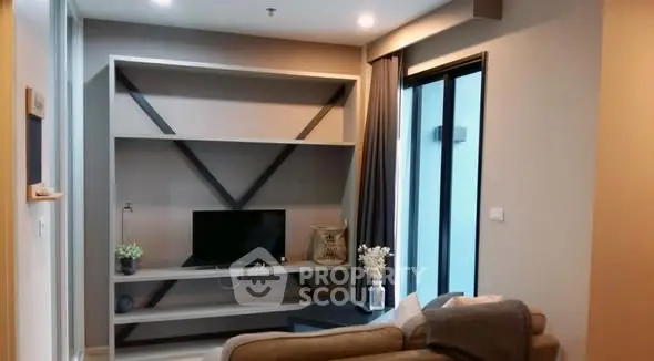 Modern living room with stylish shelving and cozy seating area