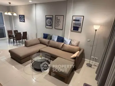 Modern living room with stylish sectional sofa and elegant dining area