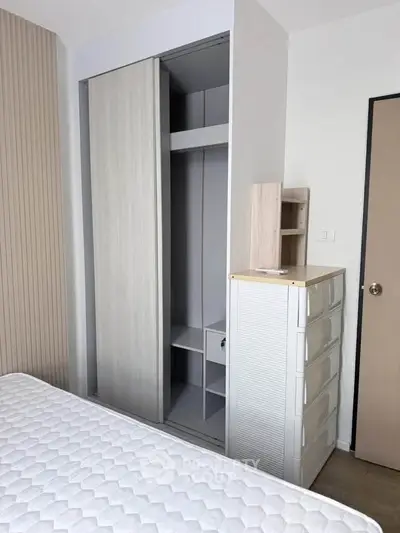 Modern bedroom with sleek wardrobe and minimalist design