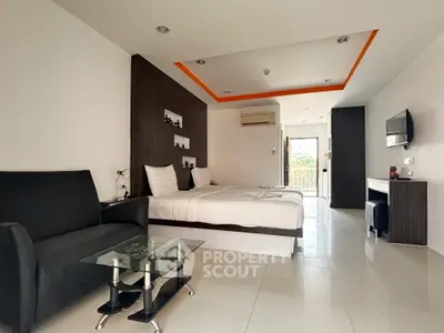 Spacious modern bedroom with sleek design and balcony access