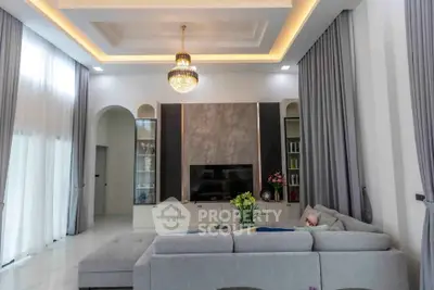 Luxurious living room with elegant chandelier and modern decor
