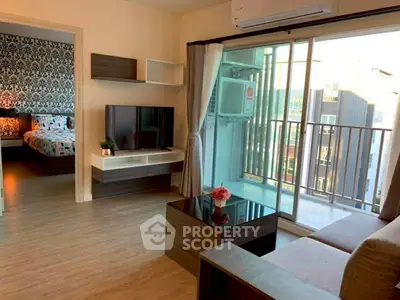 Modern living room with balcony and stylish decor in urban apartment