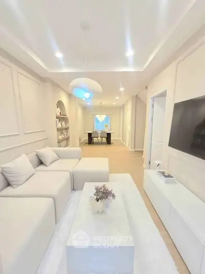 Elegant modern living room with cozy white sofa and stylish decor