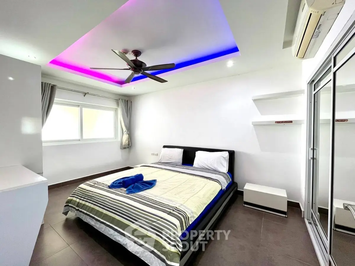 Modern bedroom with ambient lighting and sleek design