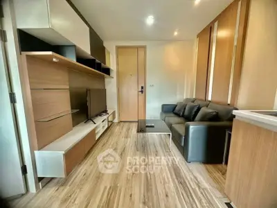 Modern living room with sleek furniture and wooden flooring, perfect for urban living.