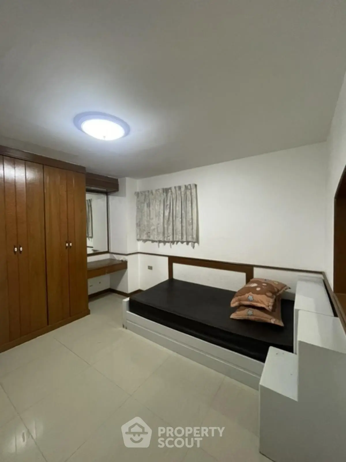Cozy bedroom with built-in wardrobe and minimalist design