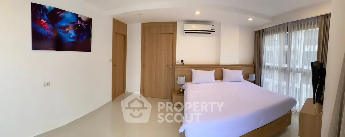 Modern bedroom with large windows and stylish decor