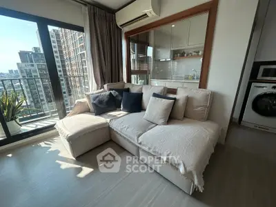 Modern living room with cozy sofa and balcony view in urban apartment