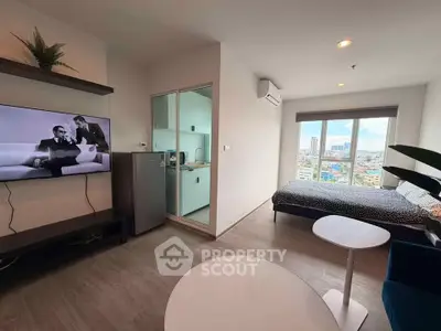 Modern studio apartment with city view, featuring sleek design and open layout.