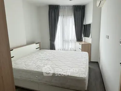 Modern bedroom with large window and minimalist furniture design.