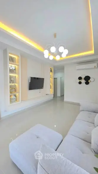 Modern living room with elegant lighting and sleek TV setup