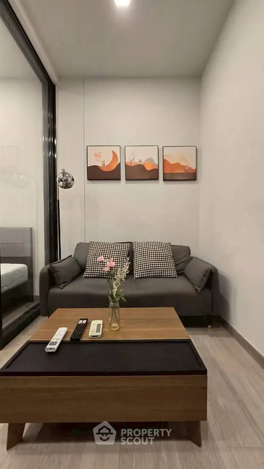 Modern living room with stylish decor and cozy sofa in a contemporary apartment.
