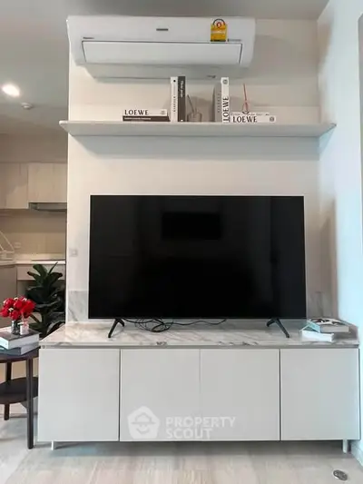 Modern living room with sleek TV unit and air conditioning, perfect for stylish urban living.