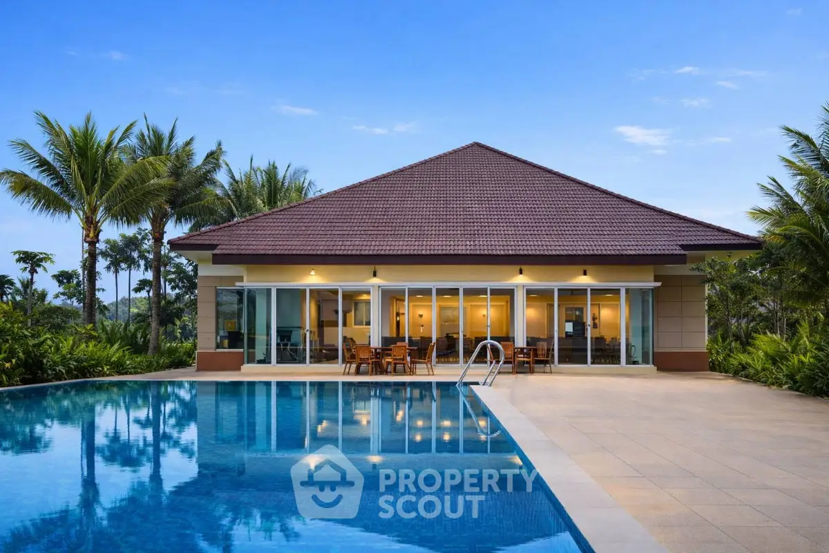 Luxurious villa with stunning pool and lush garden, perfect for serene living.