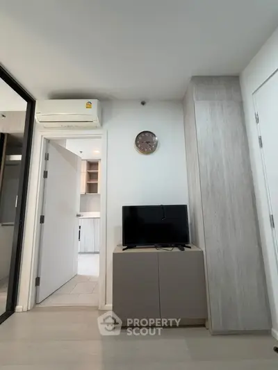 Modern apartment interior with TV, air conditioning, and stylish decor