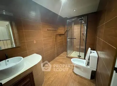 Modern bathroom with glass shower and sleek fixtures