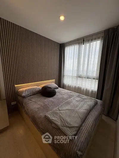 Cozy bedroom with modern decor and natural light