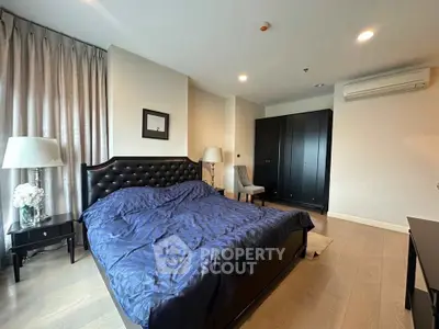 Luxurious bedroom with elegant decor and modern furnishings in a stylish apartment.