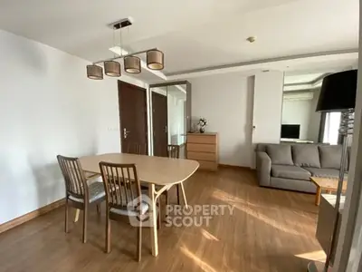 Spacious living room with modern furniture and wooden flooring