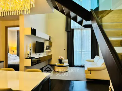 Luxurious modern living room with elegant staircase and stylish decor