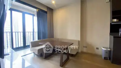 Modern living room with large windows and city view, featuring a cozy corner sofa and sleek wooden table.