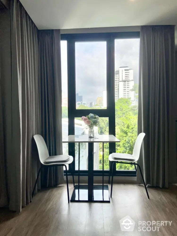 Chic modern dining nook with city view, perfect for urban living.