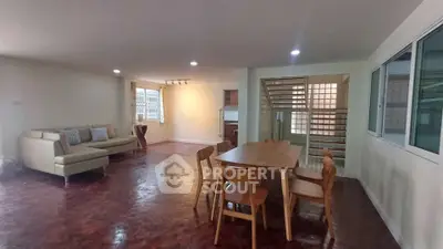 Spacious living room with elegant dining area and modern furniture