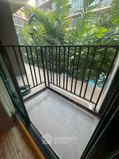 Modern balcony with lush greenery and sleek design elements