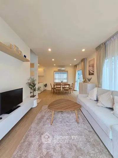Spacious modern living room with elegant decor and natural light