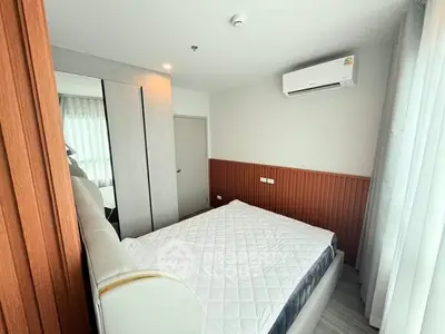 Modern bedroom with air conditioning and stylish wood paneling