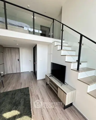 Modern duplex apartment with sleek staircase and stylish interior design