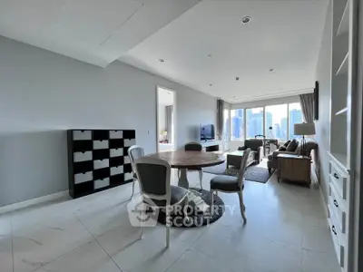 Spacious modern living room with elegant dining area and city view