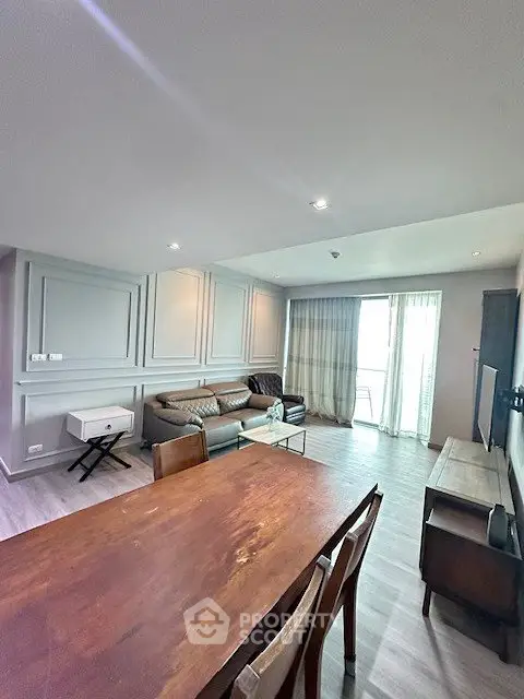 Spacious living room with modern decor and natural light