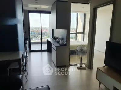 Modern apartment interior with open layout and balcony view