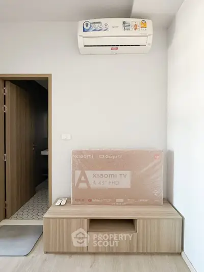 Modern living room with air conditioning and new Xiaomi TV setup