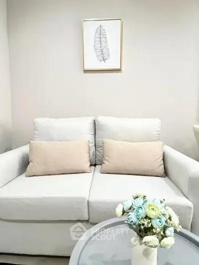 Cozy living room with elegant sofa and floral decor