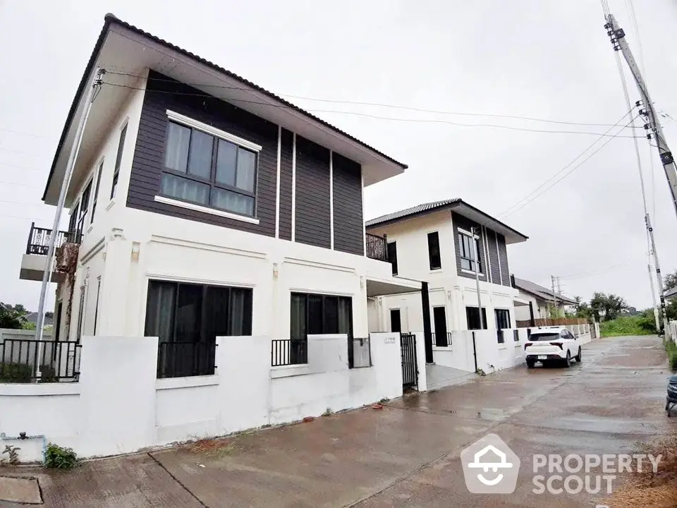 Modern two-story house with sleek design and spacious driveway