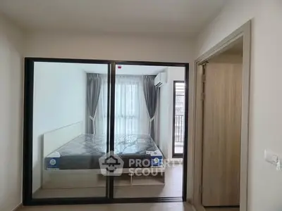 Modern bedroom with mirrored wardrobe and large window for natural light