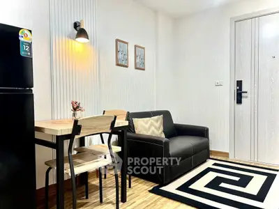 Modern living room with stylish decor and compact dining area