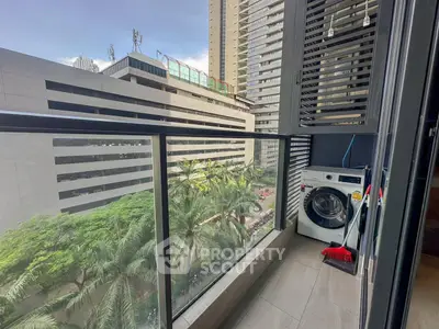 Modern balcony with city view and washing machine, perfect for urban living.