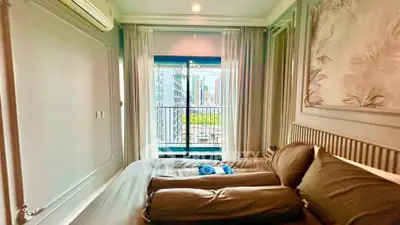 Luxurious bedroom with city view and elegant decor in modern apartment