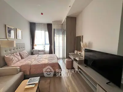 Modern bedroom with stylish decor, large window, and cozy furnishings in a contemporary apartment.