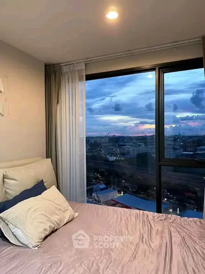 Stunning bedroom with panoramic city view and cozy ambiance
