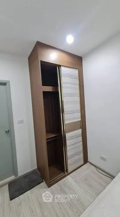 Modern bedroom with sleek built-in wardrobe and minimalist design