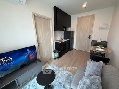 Modern compact living room with open kitchen in a stylish apartment