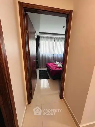 Cozy bedroom with large window and modern decor