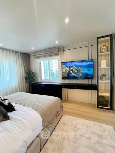 Luxurious bedroom with modern decor and large window view